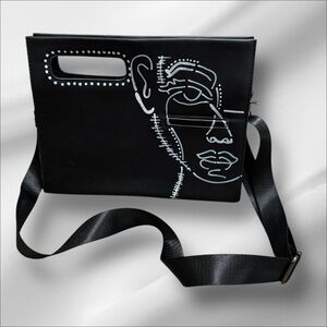 Black Crossbody Bag with Abstract Face Design
